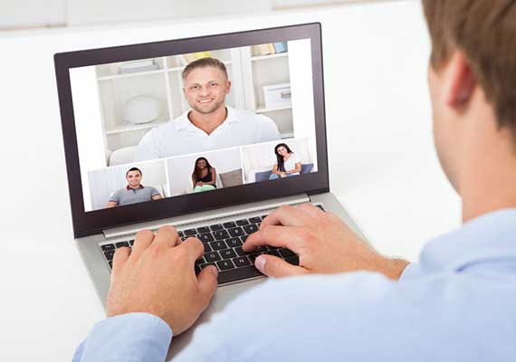 Image of a web conference on a laptop